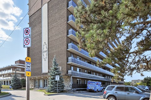 A building with a no parking sign in front of it.