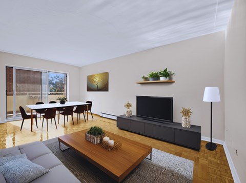 A modern living room with a wooden coffee table and grey sofa.