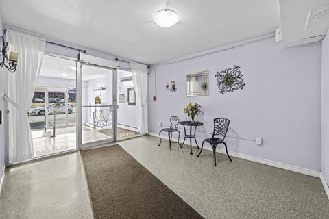 A room with a table and chairs in it.