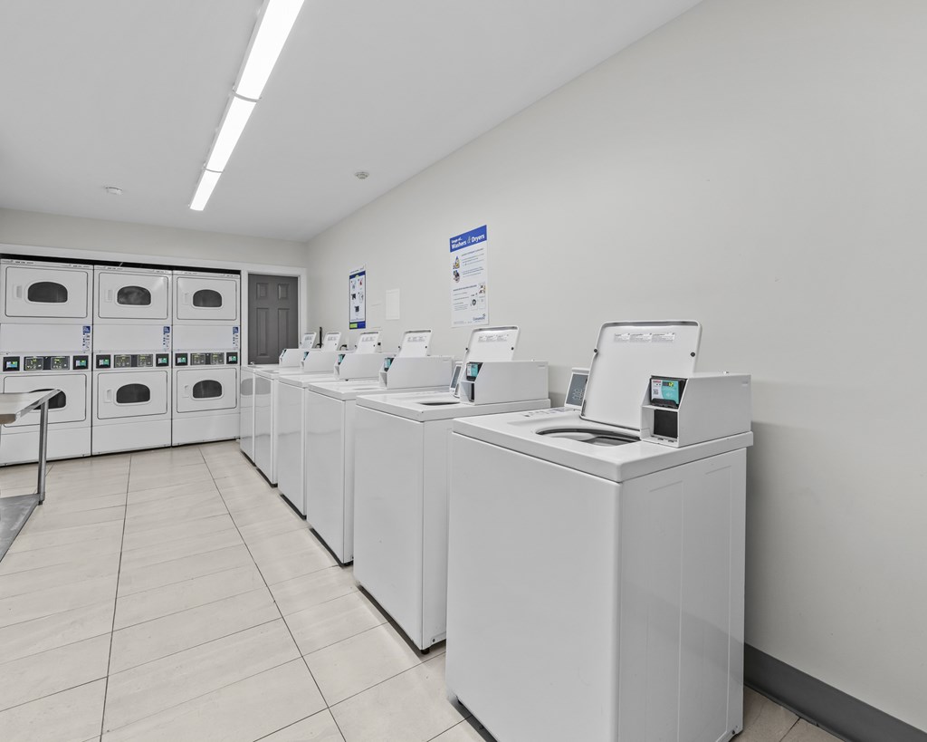 A row of washing machines in a laundromat.