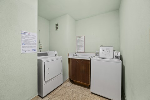 A laundry room with a washer and dryer.
