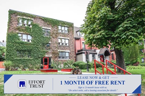 A building with a sign that says "1 month of free rent".