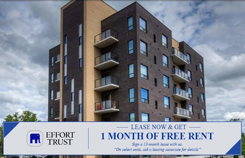 A large building with a sign that says "Effort Trust 1 Month of Free Rent".