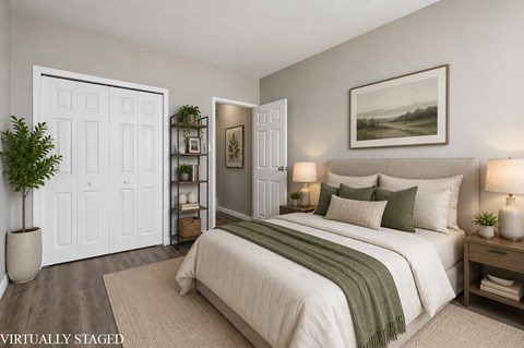 A bedroom with a bed, nightstands, and a painting on the wall.