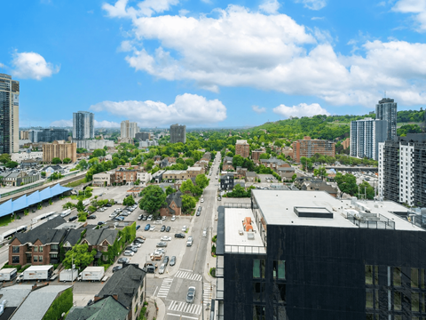 A cityscape with a mix of residential and commercial buildings.