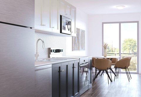A modern kitchen with a dining table and chairs.at The Maverick, Kitchener Ontario