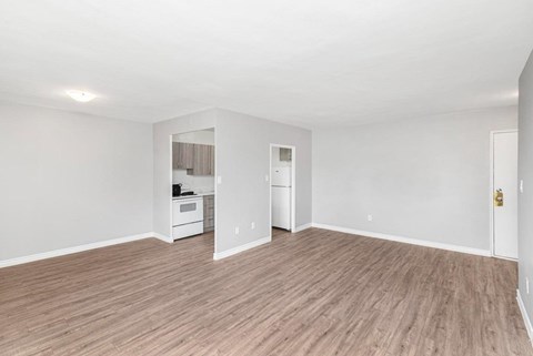 A room with a white wall and a white door.