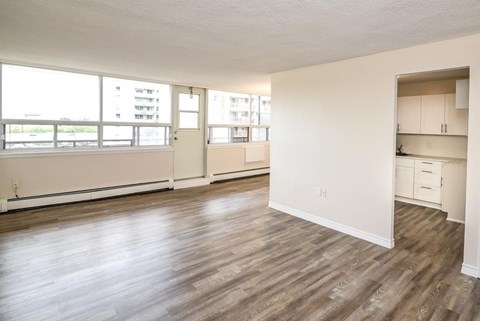 A room with wooden floors and white walls.