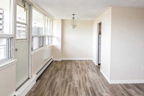 A room with a window and a door.