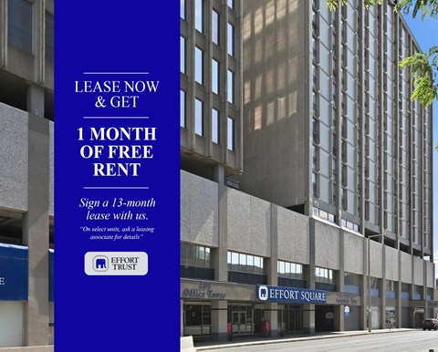 large blue sign offering a free month of rent for signing a 13-month lease.