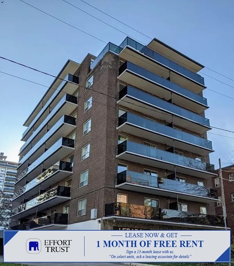 A tall building with a sign that says "Effort Trust 1 month of free rent".
