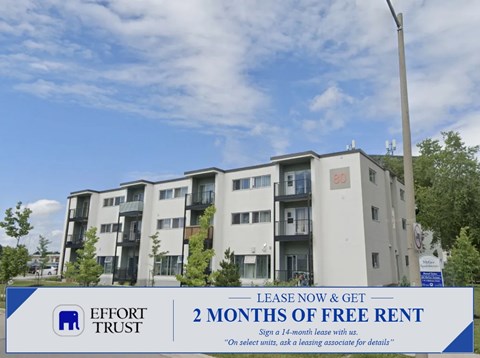 A building with a sign offering 2 months of free rent.