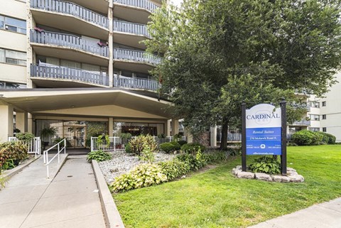 A building with a sign that says Cardinal in front of it.