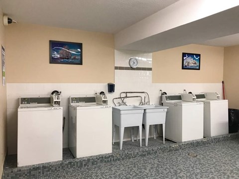 A laundromat with washers and dryers.