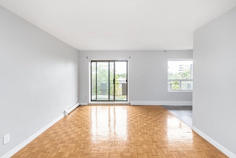 A room with wooden floors and white walls.