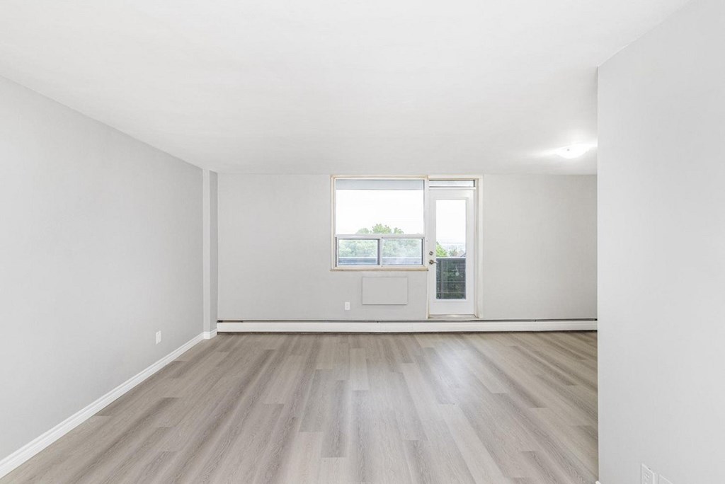 A room with a door and a window.