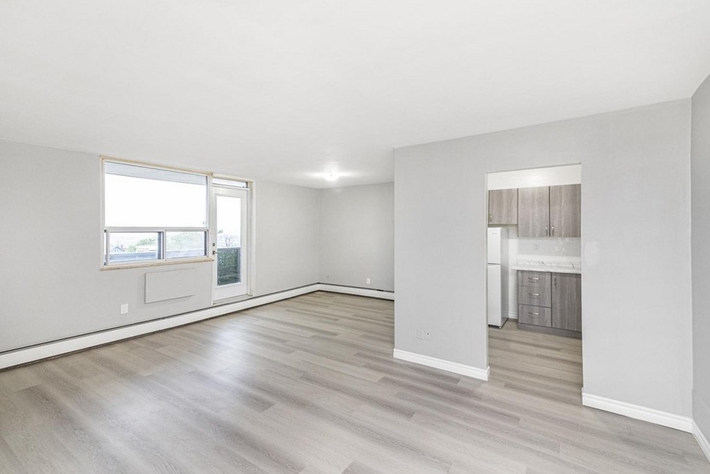 A room with a window and a door.