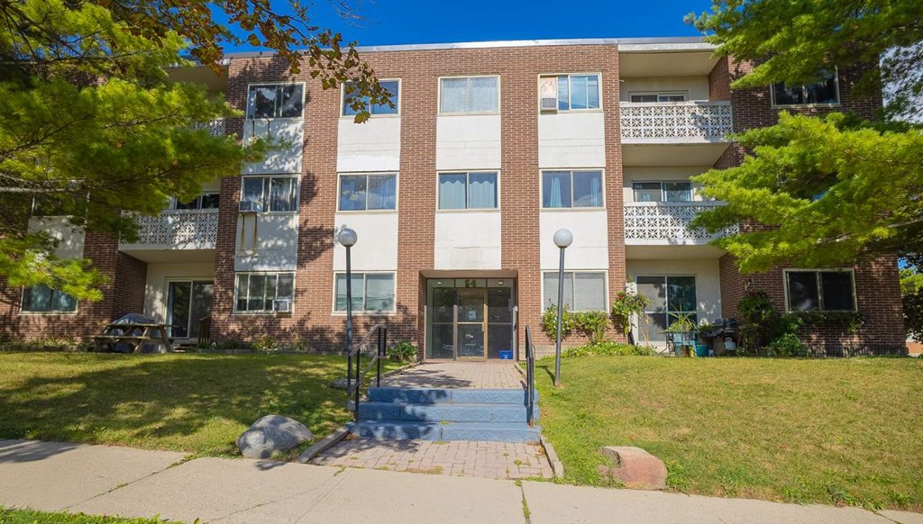 A large brick building with a balcony on the second floor.