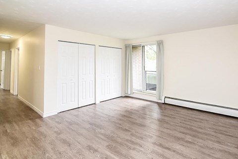 A room with a sliding door and a window.