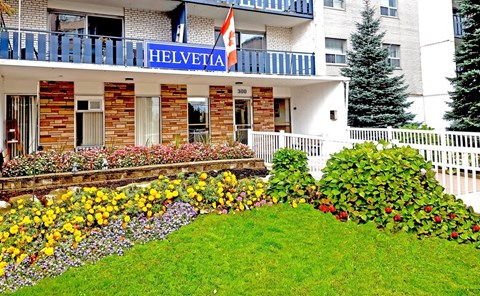 A building with a sign that says "Helvetia" on it.