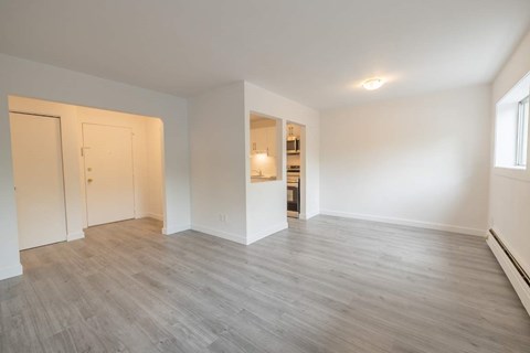 A room with a grey floor and white walls.