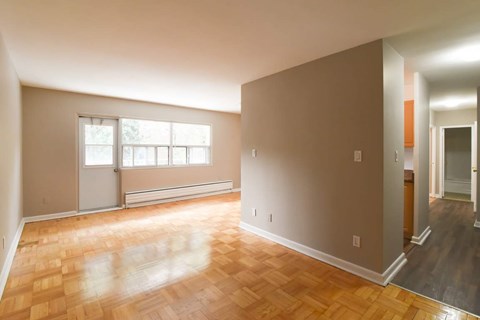 A room with a window and a door.