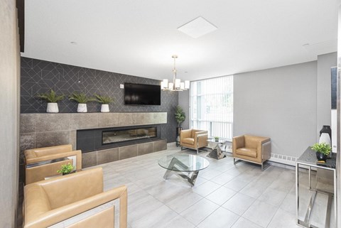 A modern living room with a fireplace and a glass coffee table.