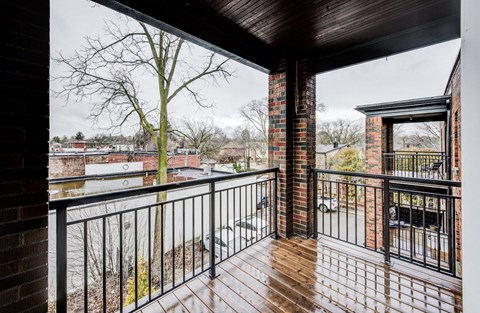 A balcony with a view of a town.