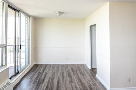 A room with a window and a door.