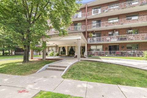 A red cross is painted on the sidewalk.