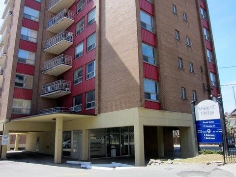 A tall building with a sign that says Westgate Towers.