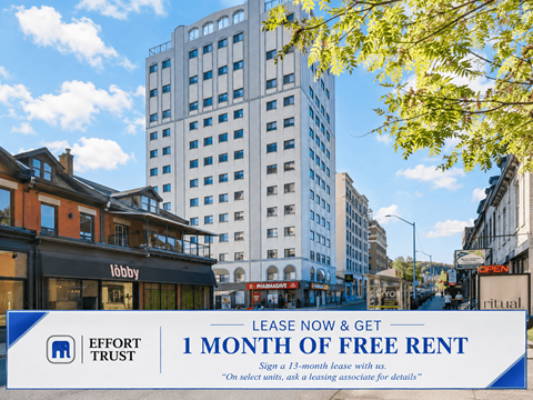 A large billboard advertising a free month of rent from Effort Trust.