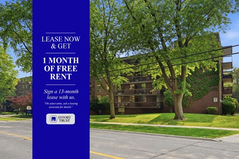 A blue sign offering a free month of rent for signing a 13-month lease.