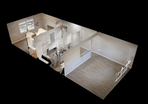 A 3D image of a house interior with a kitchen, living room, and bathroom.