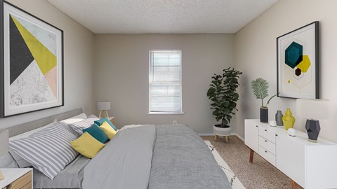 A bedroom with a bed, nightstand, and a dresser.
