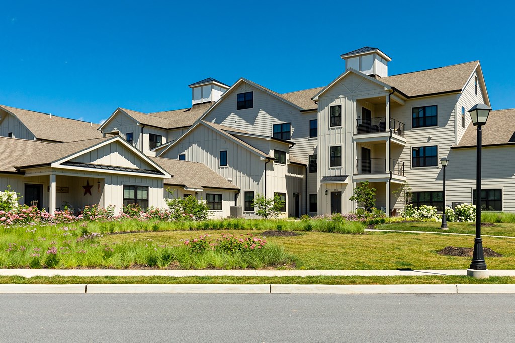 A row of houses with a street in front.