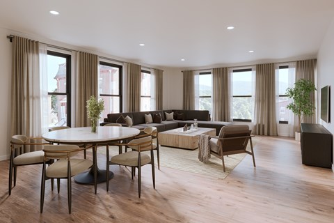 A modern living room with a large table and chairs.