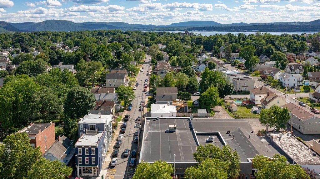 A view of a town from above with buildings and trees.