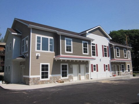 A two-story house with a grey and white exterior.