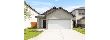 A modern house with a white garage door.