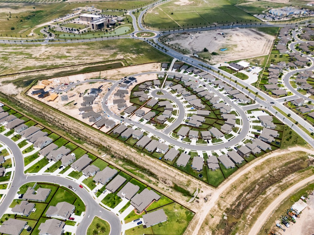 A large roundabout is in the center of a residential neighborhood.