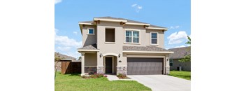 A two-story house with a garage door and a driveway.