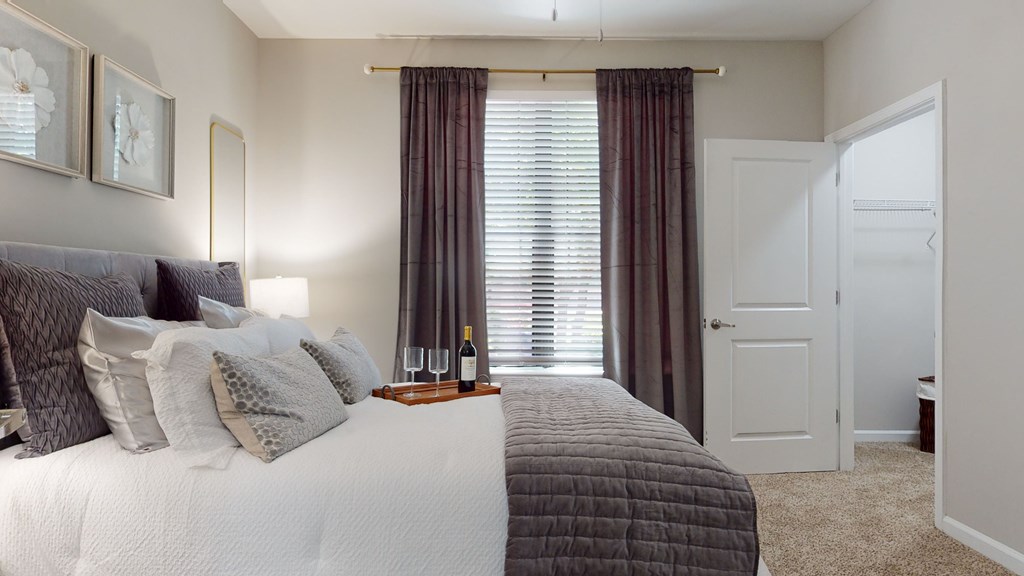 A bedroom with a large bed and a window with curtains at Embry Hills, Atlanta, GA, 30042