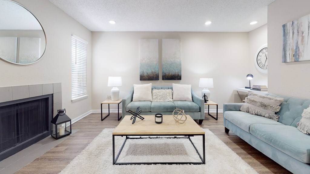 A living room with a fireplace and a couch.