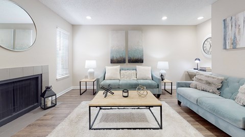 A living room with a fireplace and a couch.