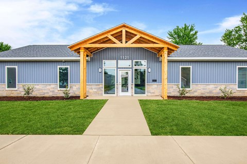 A building with a wooden front entrance and a glass door.