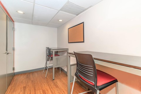 A room with a desk and chair.
