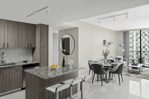 A modern kitchen with a dining  at Palma, Doral, FL