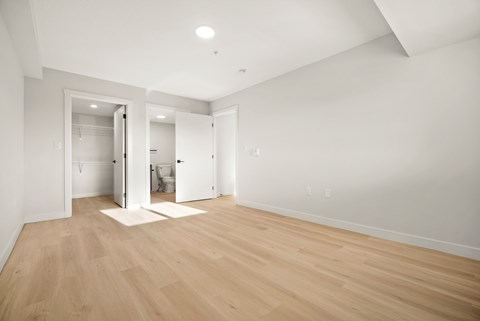A room with wooden floors and white walls.