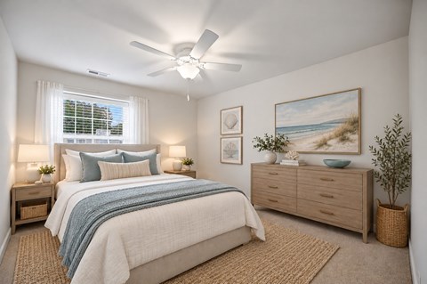 A bedroom with a bed, nightstands, and a ceiling fan.